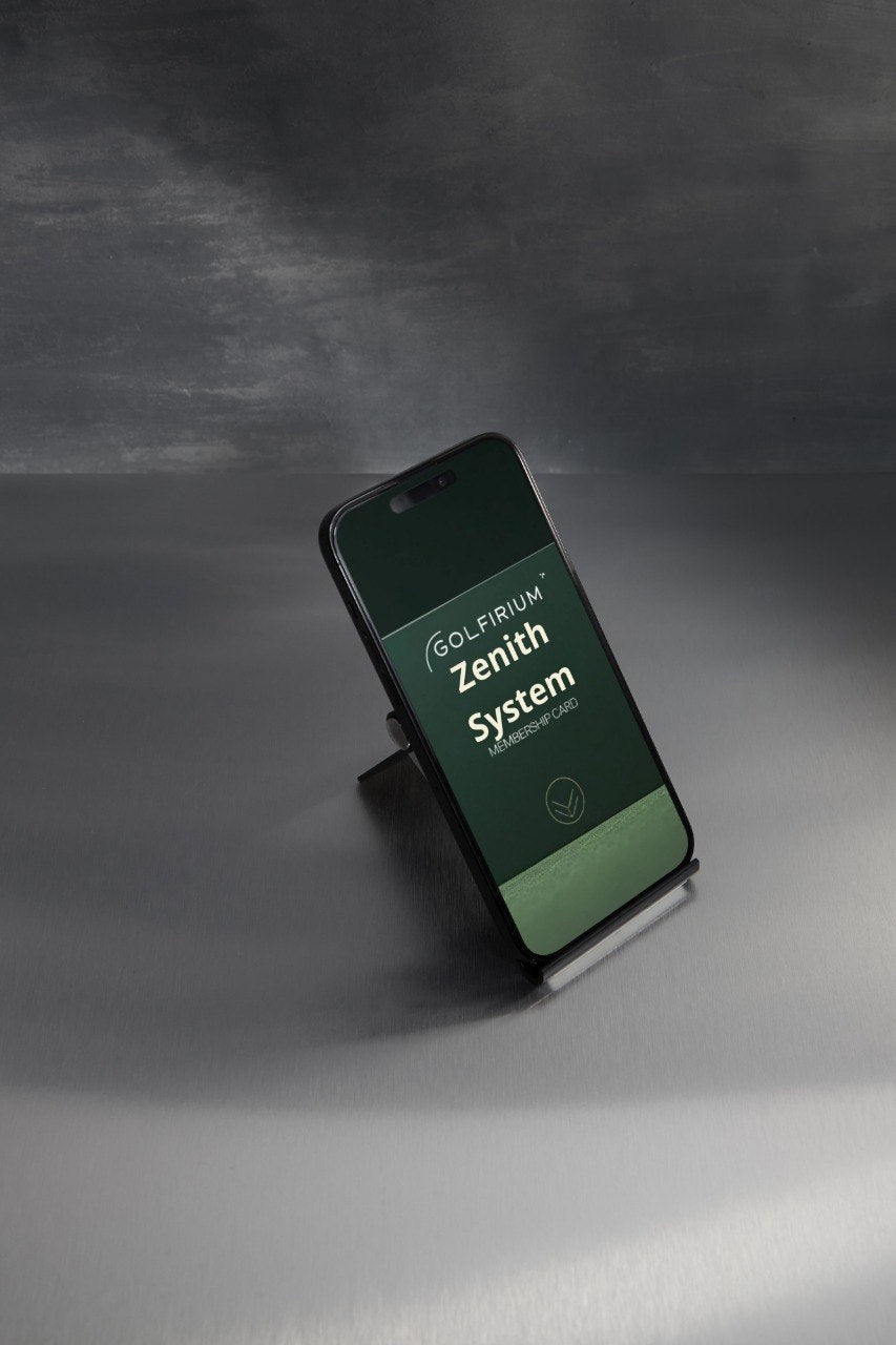 Phone on a stand displaying 'Golfiru Zenith System' on a dark background
